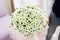 Bride holding beautifil wedding bouquet