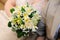 Bride holding beautiful yellow wedding bouquet