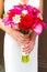 Bride Holding Bouquet of Mixed Flowers