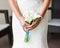 Bride holding a bouquet of white callas