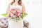 Bride Holding Fresh Pink Roses, Gypsophila and Fern Bouquet