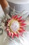 Bride holding her beautiful protea flower bouquet