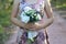 The bride is holding her bouquet of flowers