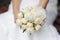 Bride holding peonies wedding bouquet