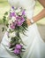 Bride holding pink and white wedding flowers