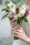 The bride holding soft wedding bouquet of roses, nice wedding bouquet in bride`s hand