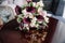 The bride holding soft wedding bouquet of roses, peonies and eustoma, horizontal shot