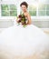 Bride holding unusual wedding bouquet