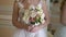 Bride holding wedding bouquet