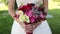 Bride holding wedding bouquet