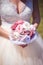 Bride holding wedding bouquet