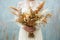 bride holding a wedding bouquet with golden blooms