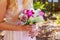 The bride holding wedding bouquet of pink and white roses