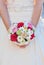 Bride holding wedding flowers