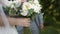 Bride holds elegant bouquet with eustoma pastel colors and greens