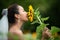 Bride holds a wedding bouquet. Bride wedding white dress with sunflower in the garden.