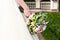 Bride holds a wedding bouquet, wedding dress , wedding details. Wedding ceremony concept.