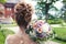 Bride holds a wedding bouquet, wedding dress , wedding details. Wedding ceremony concept.