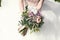 Bride holds a wedding bouquet, wedding dress , wedding details. Wedding ceremony concept.