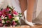 Bride legs with boquet