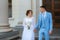 Bride in a light wedding dress to the groom in a blue suit