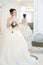 Bride in luxury interior in palace. Wedding, attractive brunette