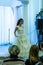 A bride model in a wedding dress walking down from a podium