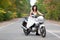 Bride on motorcycle.
