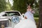 Bride near vintage retro car for wedding