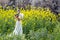 Bride portraint with white wedding dress in cole flower field
