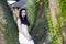 Bride portraint with white wedding dress in front of Old trees and old building
