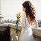 Bride poses back with lily bouquet with cityscape on the background