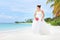 A bride posing on a beach in Maldives island