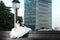 Bride posing in city