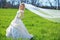 Bride posing in field