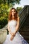 Bride posing on old stairs