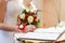 Bride puts signature in registry office.