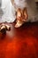 A bride is putting her shoes on closeup. She is wearing a white weeding dress