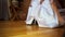 Bride Raises Wedding Dress Shows Foot in Stocking Closeup