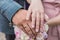 The bride& x27;s bouquet. Rings newlyweds. A bouquet of flowers with rings. Hands newlywed