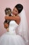 Bride\'s portrait with a Yorkshire terrier in studio