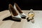 Bride`s shoes, perfume and wedding rings