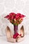 Bride`s wedding accessories: wedding shoes and bouquet or boutonniere