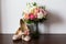 Bride`s wedding accessories: wedding shoes and bouquet or boutonniere