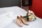Bride`s wedding accessories: wedding shoes and bouquet or boutonniere