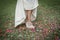Bride shoes stepping on confetti on the floor