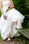 Bride showing off wedding dress and shoes