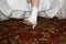 Bride shows her wedding white boots