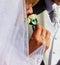 Bride smelling boutonniere