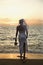 Bride standing on beach